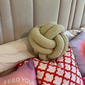 knot pillow brown